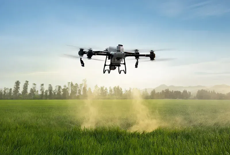An agricultural drone flying over fields