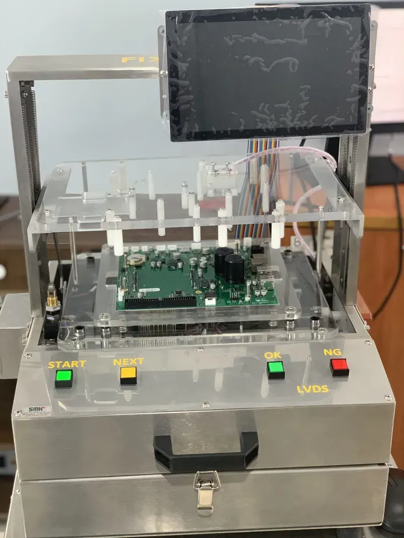 An engineer operating equipment to test a PCB
