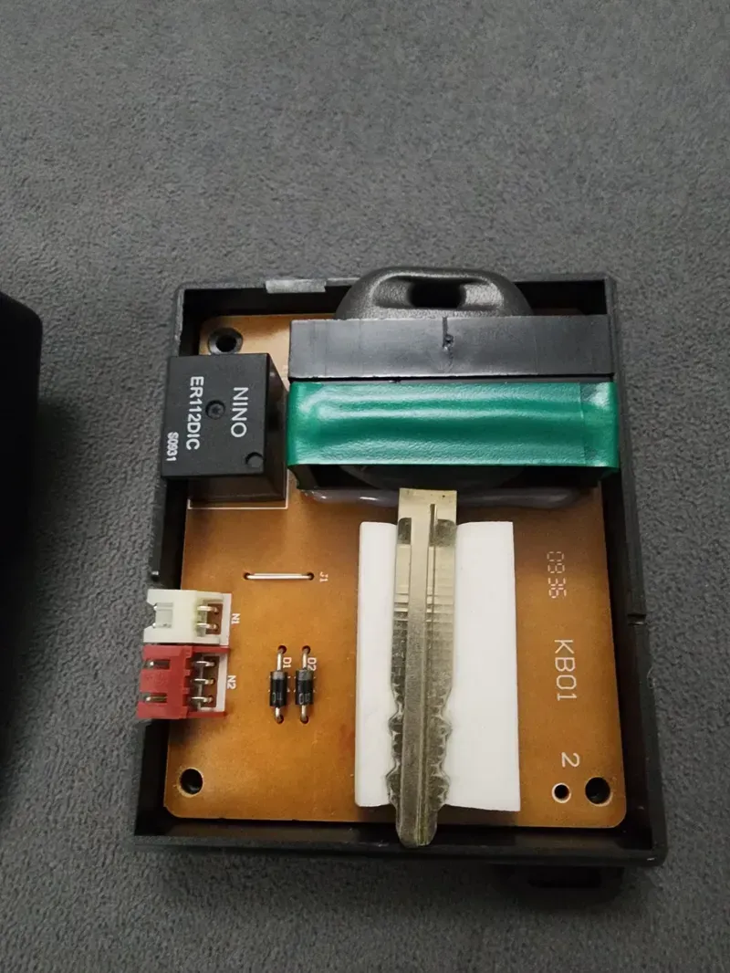 Internal view of a black box showing the PCB circuit board