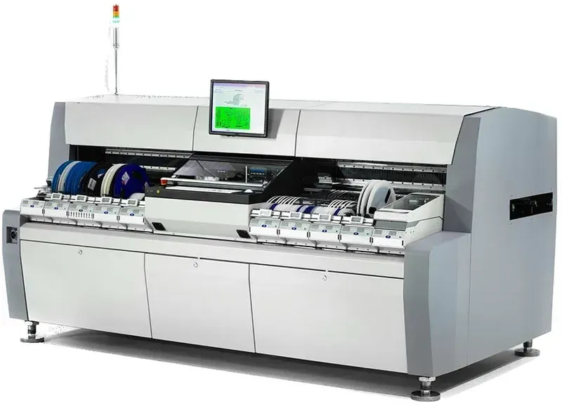 A Surface Mount Technology (SMT) assembly machine placing components on a PCB