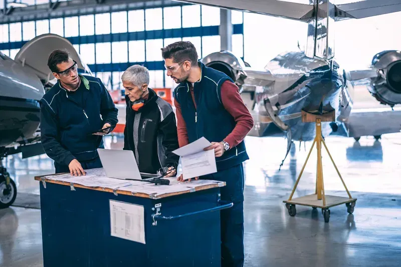 An aircraft maintenance technician checking a diagnostic test board.
