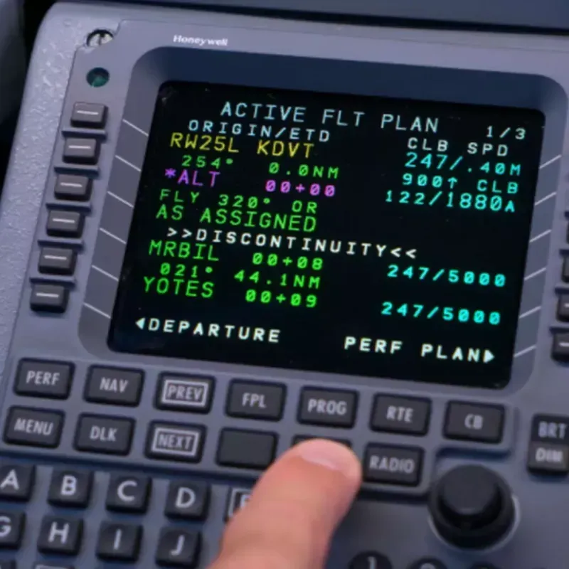 A modern aircraft cockpit with data link displays