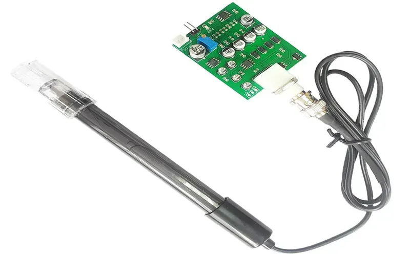 A close-up image of a sensor PCB circuit board with integrated components