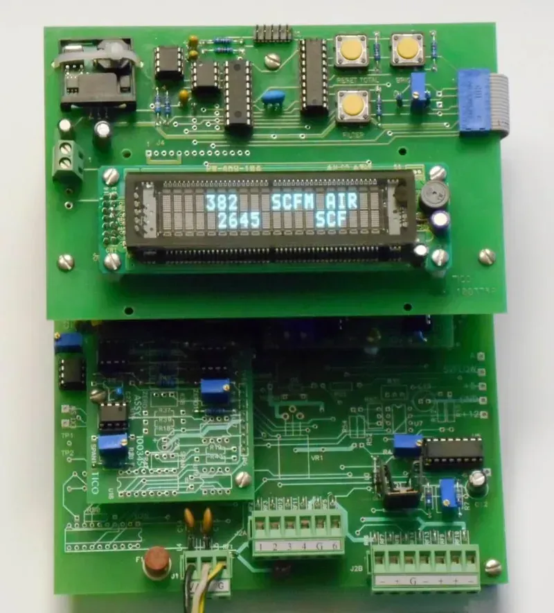 A close-up view of a flow meter signal processing board with visible components