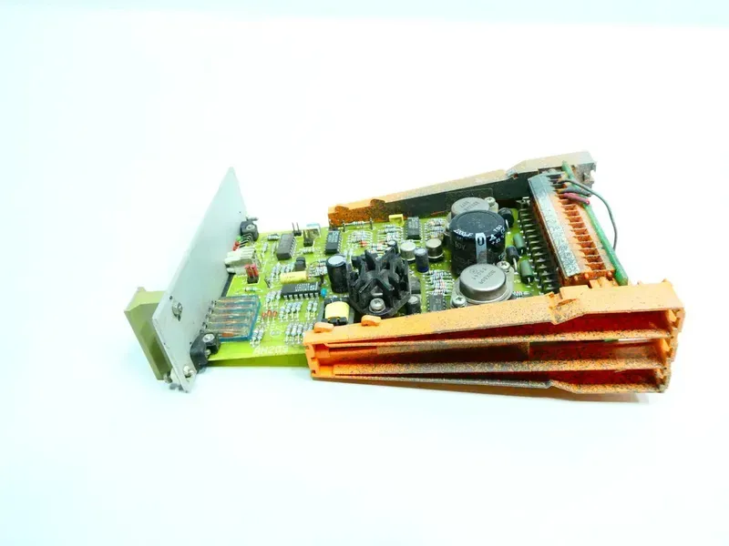 A close-up image of a PCB designed for hydraulic system control, showing various components.