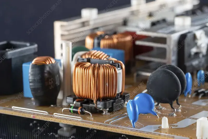 Close-up of MOSFETs and capacitors on a circuit board