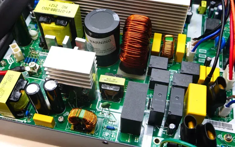A technician working on UPS PCB design and manufacturing