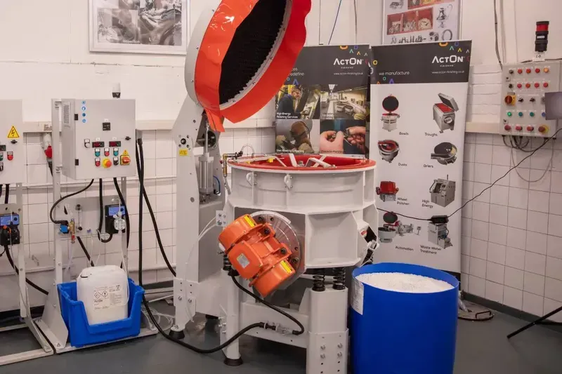 Engineer debugging automation equipment for a polishing machine