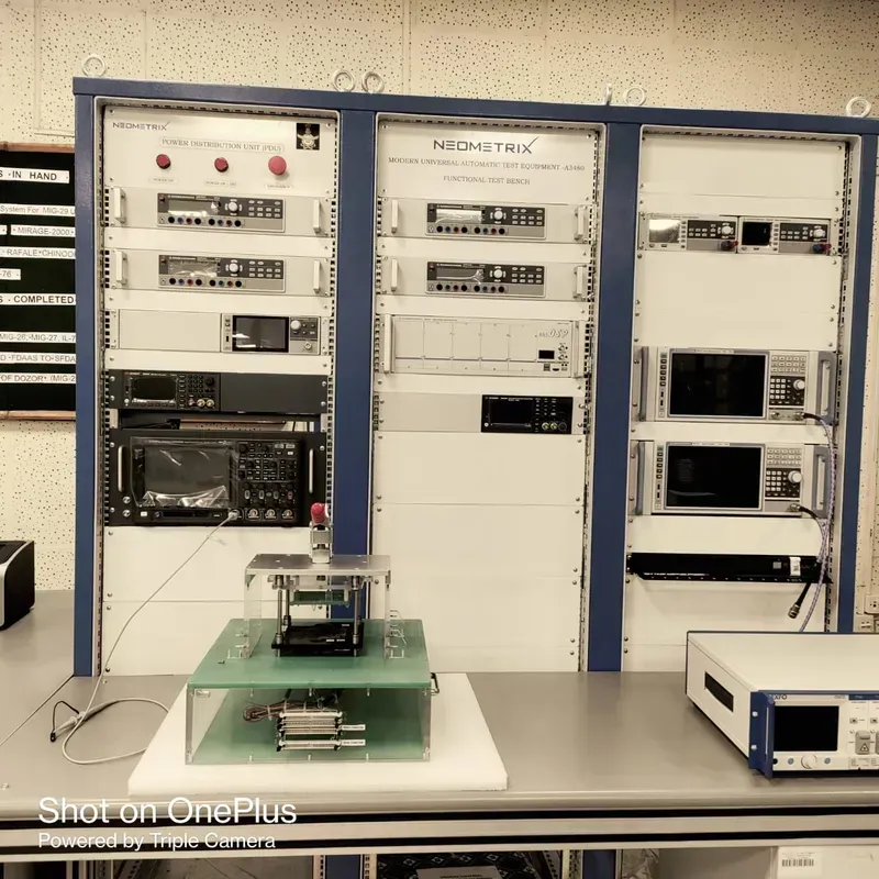 A technician operating PCB functional testing equipment