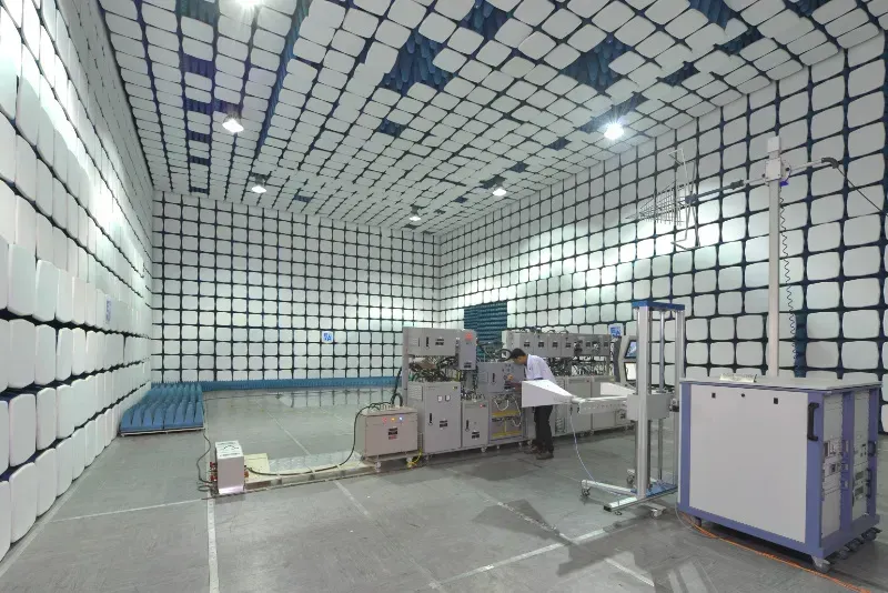 An engineer conducting electromagnetic interference testing in a lab