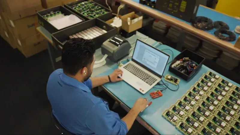 An engineer working on PCB design on a computer