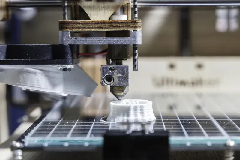 Hands assembling a rapid prototype of an electronic device