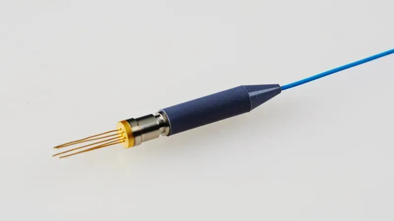 Technician performing precision assembly of an optical module