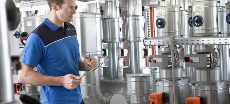 Engineers performing industrial electronics testing in a lab
