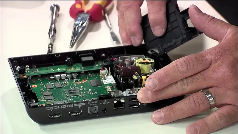 Disassembled digital set-top box showing internal components