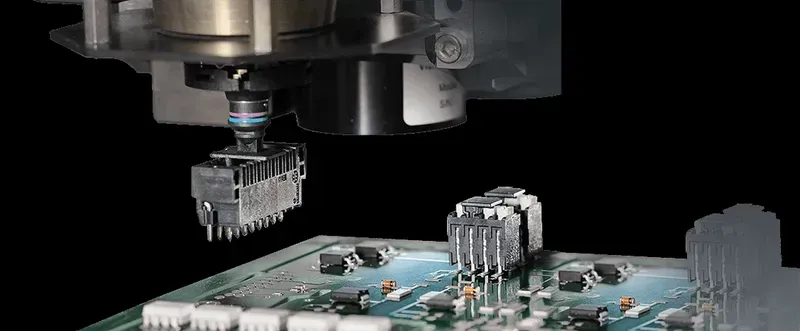Technician working on a PCB manufacturing line