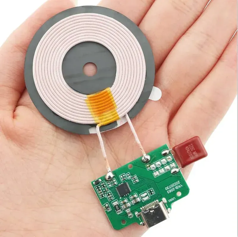 Various electronic components arranged on a wireless charging board