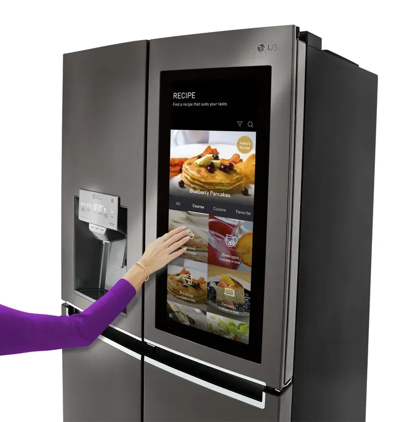 A close-up of a smart refrigerator's touchscreen display showing integrated controls
