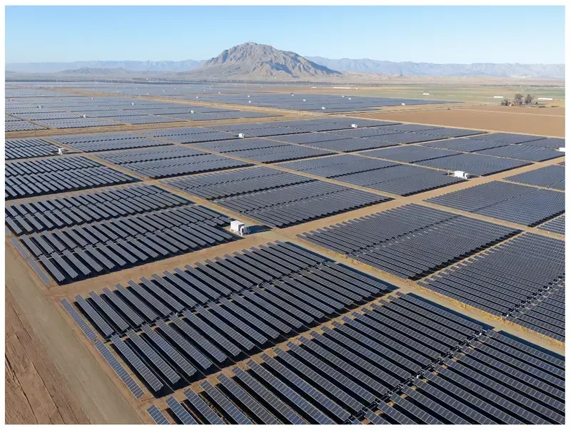 A large-scale solar farm with many solar panels