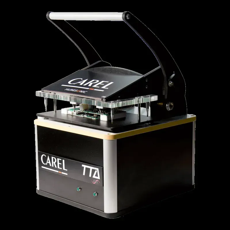 Circuit board undergoing quality testing with specialized equipment