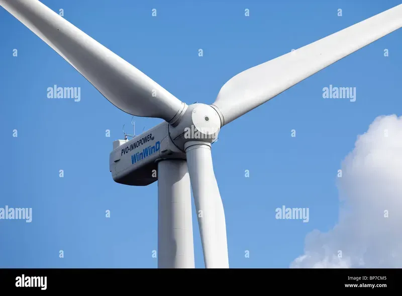 A close-up view of a wind turbine blade, emphasizing its scale and structure.