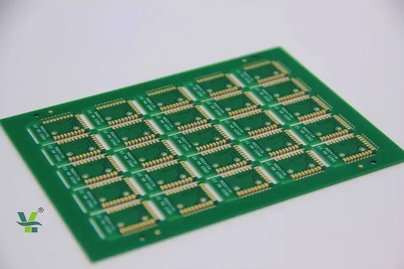 A close-up of a ruggedized PCB with heavy copper traces on a manufacturing line