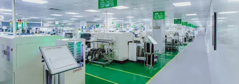 A workshop with technicians assembling PCB boards