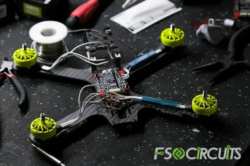 A technician installing a PCB into a military unmanned vehicle.