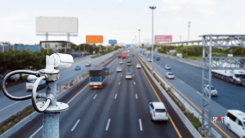 A highway surveillance camera being installed on a pole