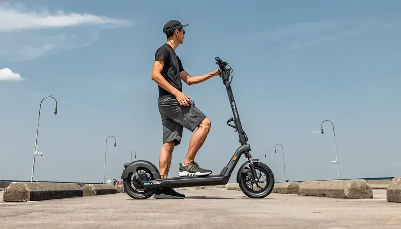 A person riding a smart scooter on a street