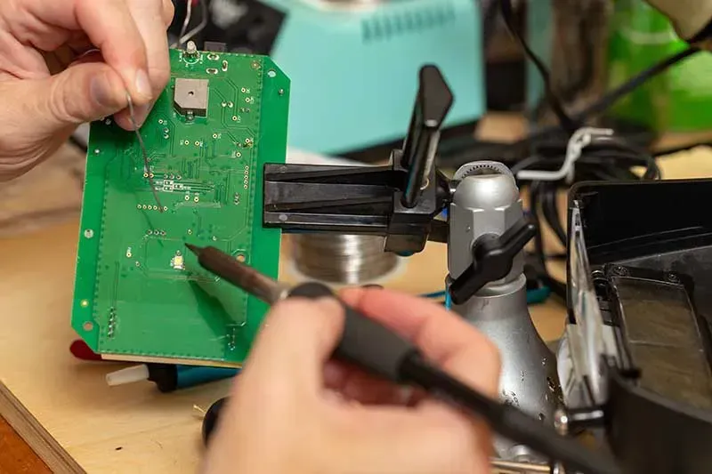 An engineer working on designing a custom PCB board