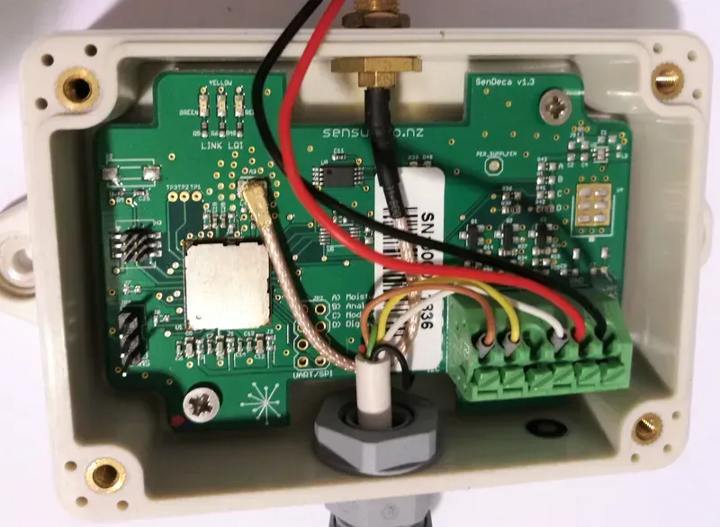 Close-up of electronic components on a smart water meter communication board