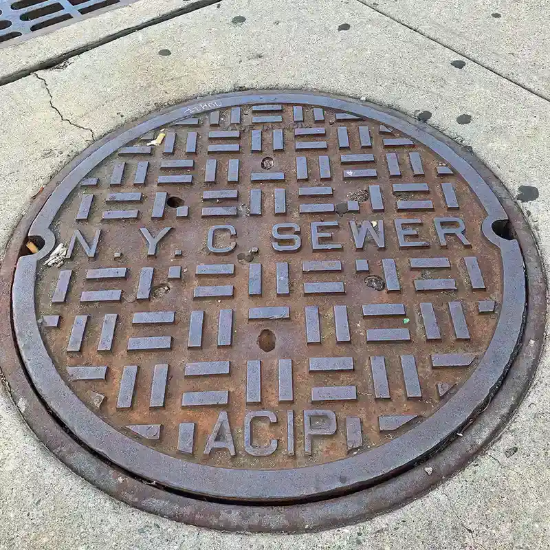 A city street with a manhole cover