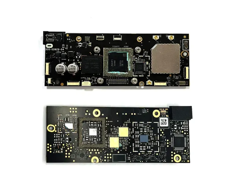 Technicians assembling a VR game console motherboard