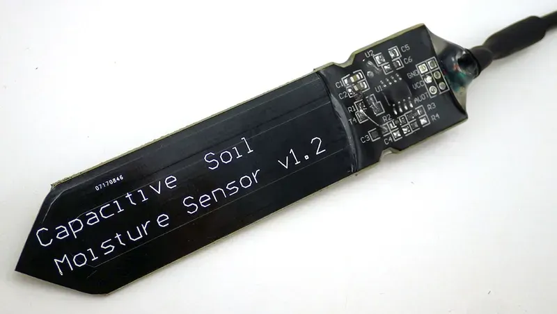 Image of a capacitive soil moisture sensor used in a PCB.